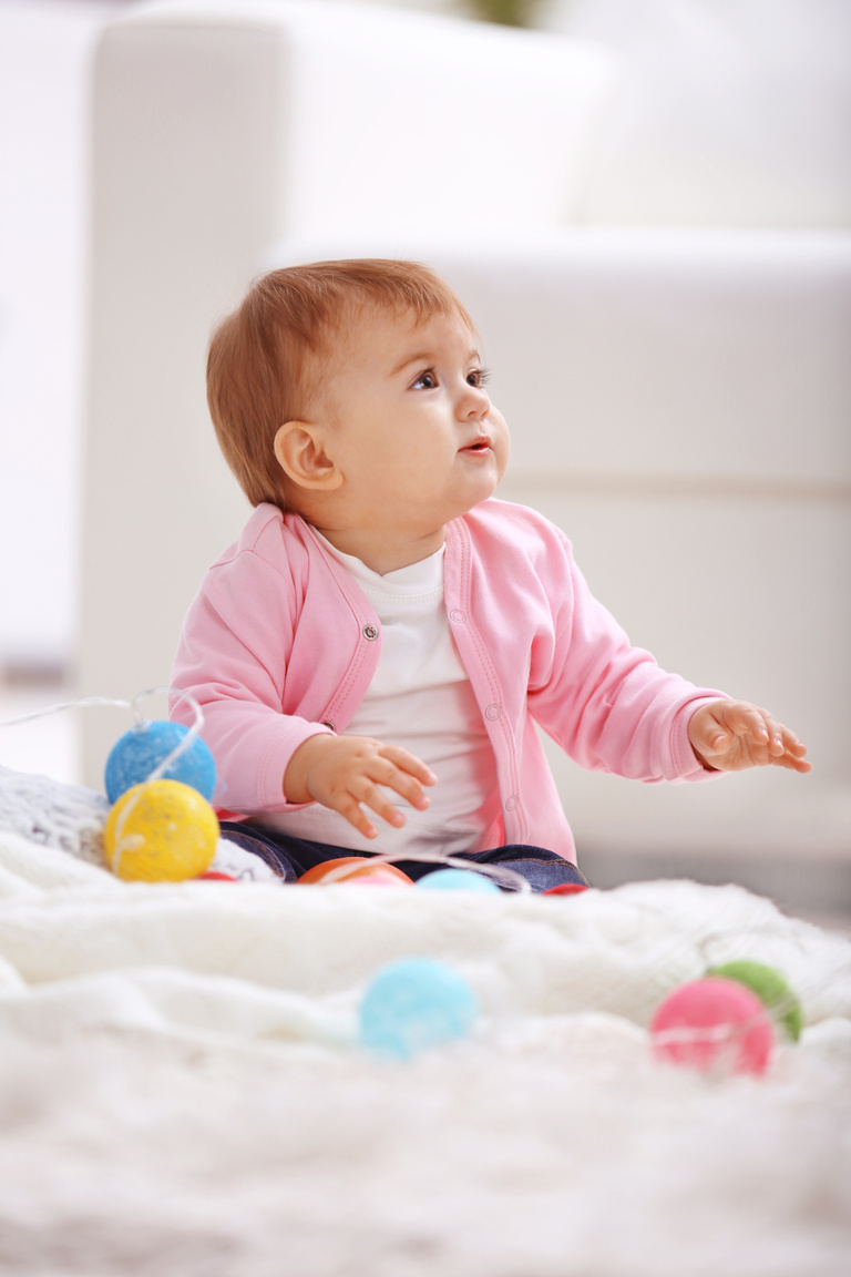 Baby Girl Playing with Colored Balls