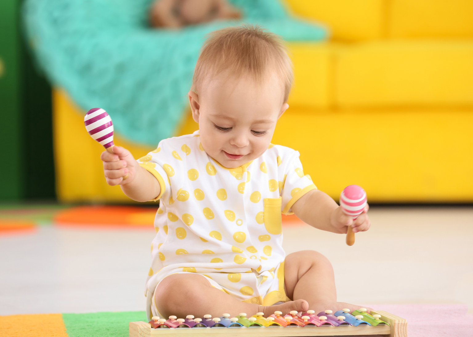 Cute Little Baby Playing with Musical Instruments at Home